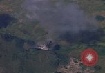 Image of A 1E Skyraider aircraft fire rockets at enemy ground target Southeast Asia, 1966, second 61 stock footage video 65675042960