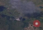 Image of A 1E Skyraider aircraft fire rockets at enemy ground target Southeast Asia, 1966, second 62 stock footage video 65675042960