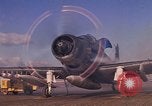 Image of A-1E Skyraider aircraft operating on ground Southeast Asia, 1966, second 11 stock footage video 65675042967