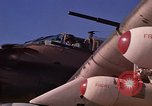 Image of A-1E Skyraider aircraft operating on ground Southeast Asia, 1966, second 28 stock footage video 65675042967
