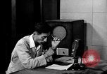 Image of Japanese Station announcer Tokyo Japan, 1945, second 19 stock footage video 65675043008