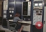 Image of Woman operates computer controls New Mexico United States USA, 1975, second 3 stock footage video 65675043084