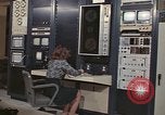 Image of Woman operates computer controls New Mexico United States USA, 1975, second 10 stock footage video 65675043084