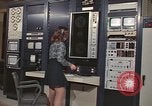 Image of Woman operates computer controls New Mexico United States USA, 1975, second 14 stock footage video 65675043084