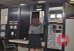 Image of Woman operates computer controls New Mexico United States USA, 1975, second 22 stock footage video 65675043084