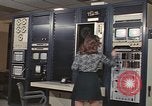 Image of Woman operates computer controls New Mexico United States USA, 1975, second 32 stock footage video 65675043084