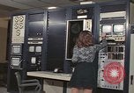 Image of Woman operates computer controls New Mexico United States USA, 1975, second 33 stock footage video 65675043084
