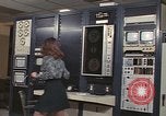 Image of Woman operates computer controls New Mexico United States USA, 1975, second 35 stock footage video 65675043084