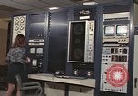 Image of Woman operates computer controls New Mexico United States USA, 1975, second 37 stock footage video 65675043084