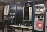 Image of Woman operates computer controls New Mexico United States USA, 1975, second 38 stock footage video 65675043084