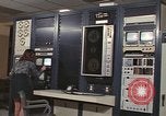 Image of Woman operates computer controls New Mexico United States USA, 1975, second 40 stock footage video 65675043084