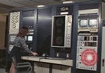 Image of Woman operates computer controls New Mexico United States USA, 1975, second 44 stock footage video 65675043084