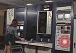 Image of Woman operates computer controls New Mexico United States USA, 1975, second 45 stock footage video 65675043084