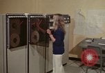 Image of Woman operates computer controls New Mexico United States USA, 1975, second 9 stock footage video 65675043085