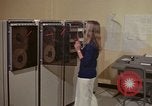 Image of Woman operates computer controls New Mexico United States USA, 1975, second 10 stock footage video 65675043085