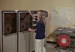 Image of Woman operates computer controls New Mexico United States USA, 1975, second 12 stock footage video 65675043085