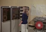 Image of Woman operates computer controls New Mexico United States USA, 1975, second 13 stock footage video 65675043085