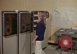 Image of Woman operates computer controls New Mexico United States USA, 1975, second 14 stock footage video 65675043085