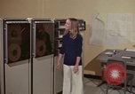 Image of Woman operates computer controls New Mexico United States USA, 1975, second 15 stock footage video 65675043085