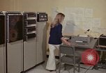 Image of Woman operates computer controls New Mexico United States USA, 1975, second 18 stock footage video 65675043085