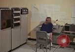 Image of Woman operates computer controls New Mexico United States USA, 1975, second 19 stock footage video 65675043085