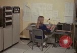Image of Woman operates computer controls New Mexico United States USA, 1975, second 21 stock footage video 65675043085