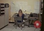 Image of Woman operates computer controls New Mexico United States USA, 1975, second 25 stock footage video 65675043085