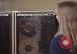 Image of Woman operates computer controls New Mexico United States USA, 1975, second 50 stock footage video 65675043085