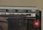 Image of Woman operates computer controls New Mexico United States USA, 1975, second 58 stock footage video 65675043085