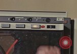 Image of Woman operates computer controls New Mexico United States USA, 1975, second 60 stock footage video 65675043085