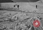 Image of ski patrolmen rescue skier Garmisch-Partenkirchen Germany, 1965, second 20 stock footage video 65675043203