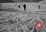 Image of ski patrolmen rescue skier Garmisch-Partenkirchen Germany, 1965, second 21 stock footage video 65675043203
