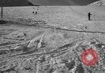 Image of ski patrolmen rescue skier Garmisch-Partenkirchen Germany, 1965, second 25 stock footage video 65675043203