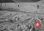 Image of ski patrolmen rescue skier Garmisch-Partenkirchen Germany, 1965, second 30 stock footage video 65675043203