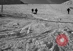 Image of ski patrolmen rescue skier Garmisch-Partenkirchen Germany, 1965, second 37 stock footage video 65675043203