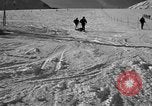 Image of ski patrolmen rescue skier Garmisch-Partenkirchen Germany, 1965, second 38 stock footage video 65675043203