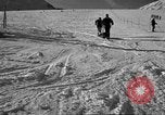 Image of ski patrolmen rescue skier Garmisch-Partenkirchen Germany, 1965, second 40 stock footage video 65675043203