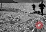 Image of ski patrolmen rescue skier Garmisch-Partenkirchen Germany, 1965, second 42 stock footage video 65675043203