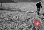Image of ski patrolmen rescue skier Garmisch-Partenkirchen Germany, 1965, second 43 stock footage video 65675043203