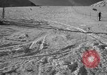 Image of ski patrolmen rescue skier Garmisch-Partenkirchen Germany, 1965, second 46 stock footage video 65675043203