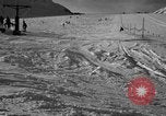 Image of ski patrolmen rescue skier Garmisch-Partenkirchen Germany, 1965, second 48 stock footage video 65675043203