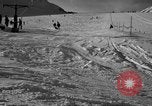 Image of ski patrolmen rescue skier Garmisch-Partenkirchen Germany, 1965, second 56 stock footage video 65675043203