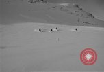 Image of Saint Bernard protecting skiers Garmisch-Partenkirchen Germany, 1965, second 4 stock footage video 65675043210