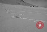Image of Saint Bernard protecting skiers Garmisch-Partenkirchen Germany, 1965, second 15 stock footage video 65675043210
