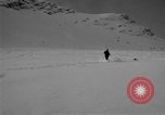 Image of Saint Bernard protecting skiers Garmisch-Partenkirchen Germany, 1965, second 19 stock footage video 65675043210