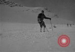 Image of Saint Bernard protecting skiers Garmisch-Partenkirchen Germany, 1965, second 25 stock footage video 65675043210