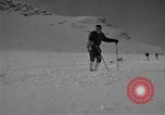 Image of Saint Bernard protecting skiers Garmisch-Partenkirchen Germany, 1965, second 26 stock footage video 65675043210