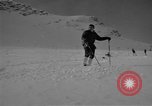 Image of Saint Bernard protecting skiers Garmisch-Partenkirchen Germany, 1965, second 27 stock footage video 65675043210