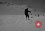 Image of Saint Bernard protecting skiers Garmisch-Partenkirchen Germany, 1965, second 32 stock footage video 65675043210