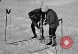 Image of Saint Bernard protecting skiers Garmisch-Partenkirchen Germany, 1965, second 42 stock footage video 65675043210